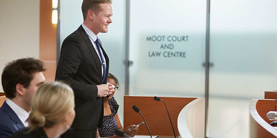 Murdoch Uni student presents in the Moot Court and Law Centre.